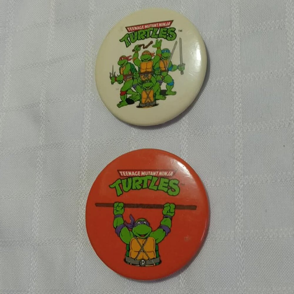 Two strange & unusual vintage button pins featuring The TNMT